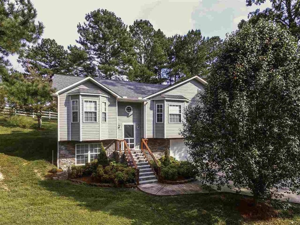 920 Grassy Branch Road Dayton, TN 37321 - Photo 1 of 21 a front view of a house with a yard and lake view