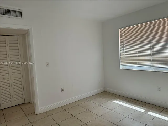 a view of an empty room with window