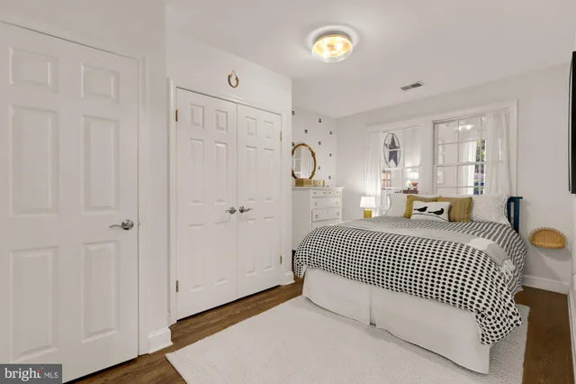 a room with a bed and window