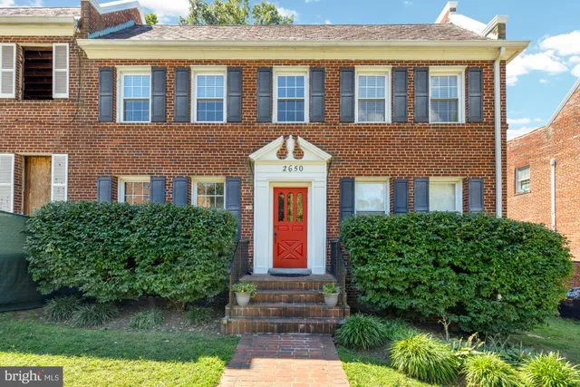 a front view of a house having yard