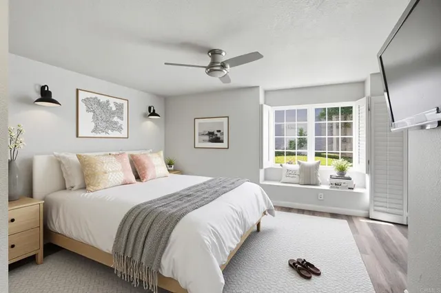 a bedroom with a large bed and a window