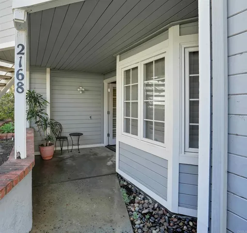 a view of house with outdoor sitting space