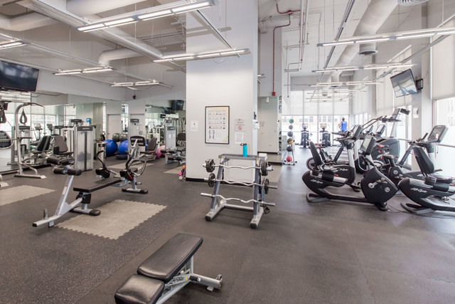 655 West Irving Park Road, Unit 2112 Chicago, IL 60613 - Photo 16 of 17 a view of a room with gym equipment