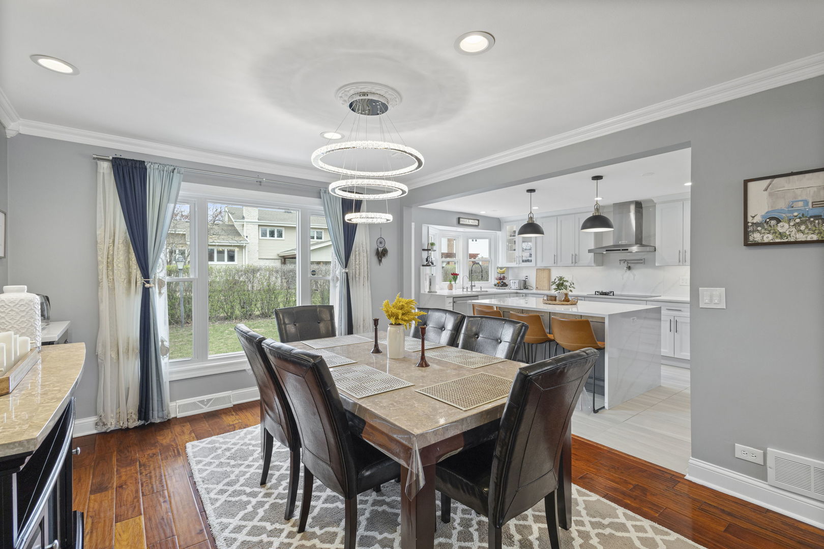 1600 Birch Street Park Ridge, IL 60068 - Photo 11 of 34 a dining room with furniture a rug and wooden floor