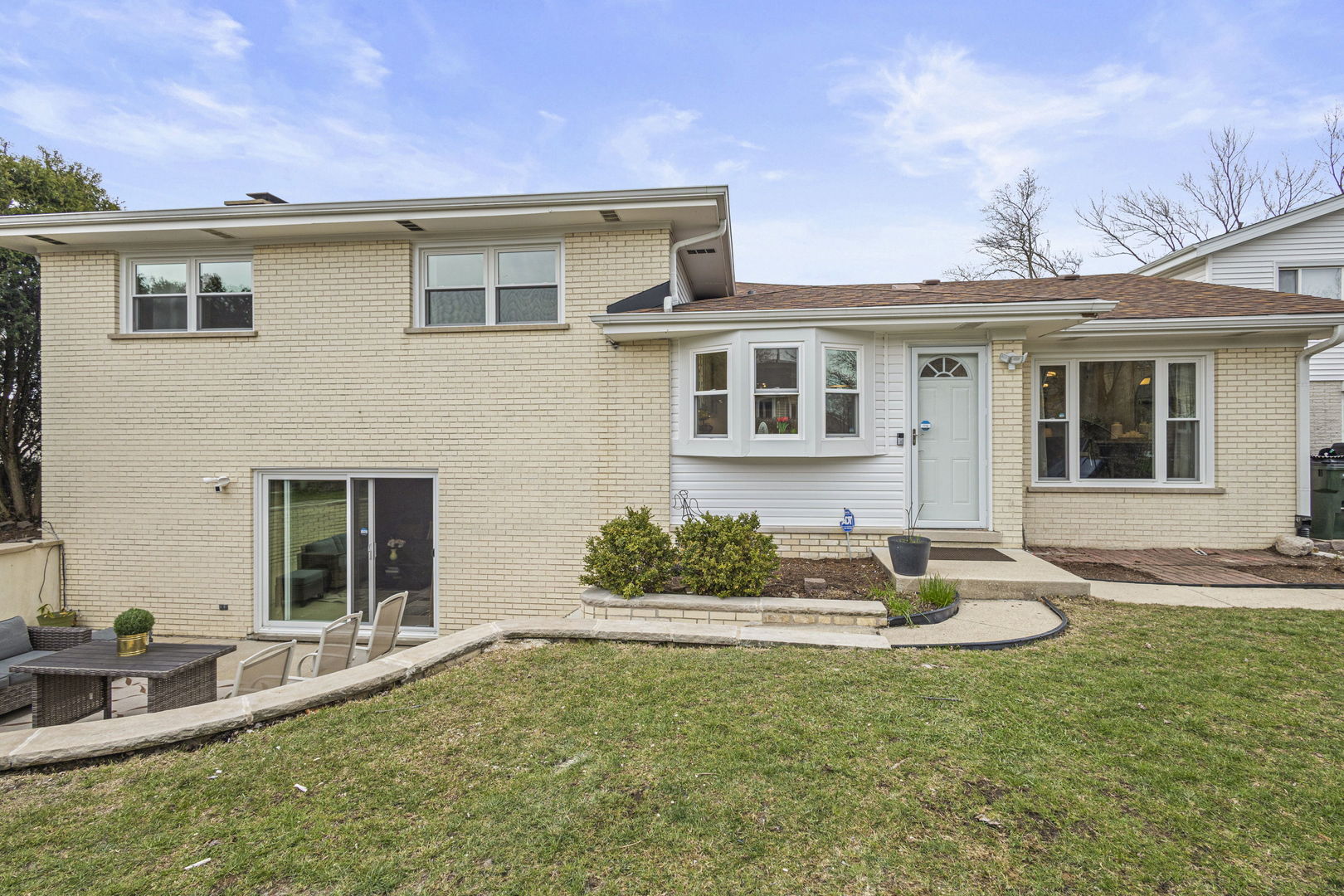1600 Birch Street Park Ridge, IL 60068 - Photo 25 of 34 a front view of a house with garden
