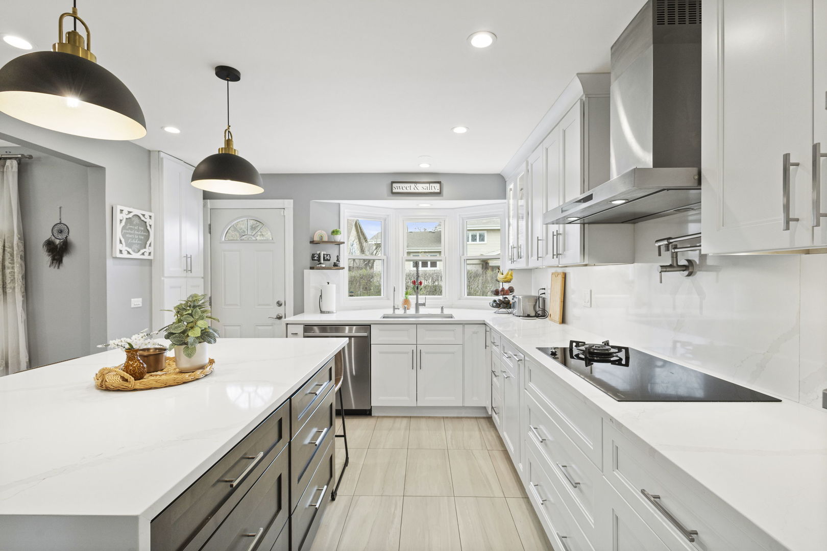 1600 Birch Street Park Ridge, IL 60068 - Photo 6 of 34 a kitchen with a sink a stove cabinets and counter space