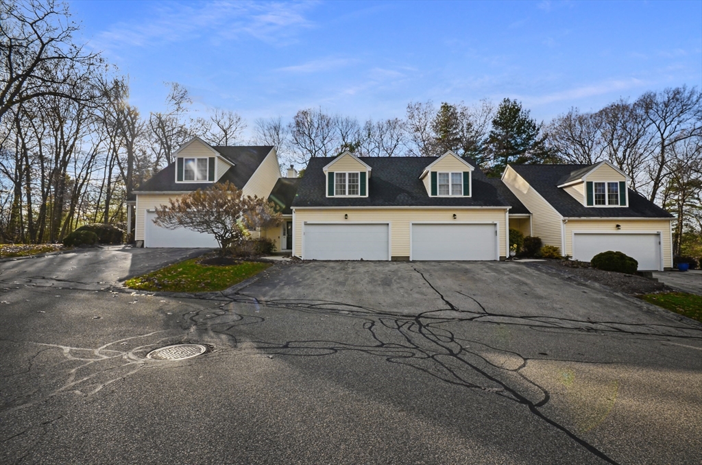 20 Millers Way, Unit C Sutton, MA 01590 - Photo 1 of 41 a front view of a house with a yard and garage