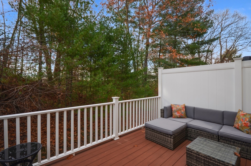 20 Millers Way, Unit C Sutton, MA 01590 - Photo 13 of 41 a roof deck with couches and wooden fence