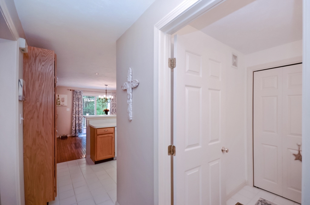 20 Millers Way, Unit C Sutton, MA 01590 - Photo 18 of 41 a view of a hallway with bathroom and front door