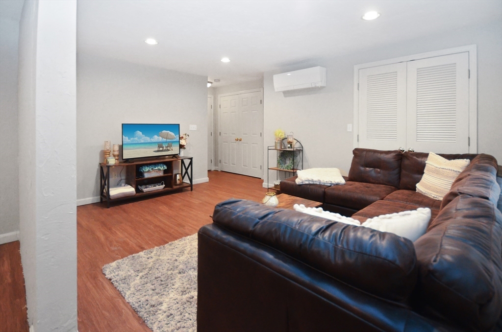 20 Millers Way, Unit C Sutton, MA 01590 - Photo 29 of 41 a living room with furniture and a flat screen tv