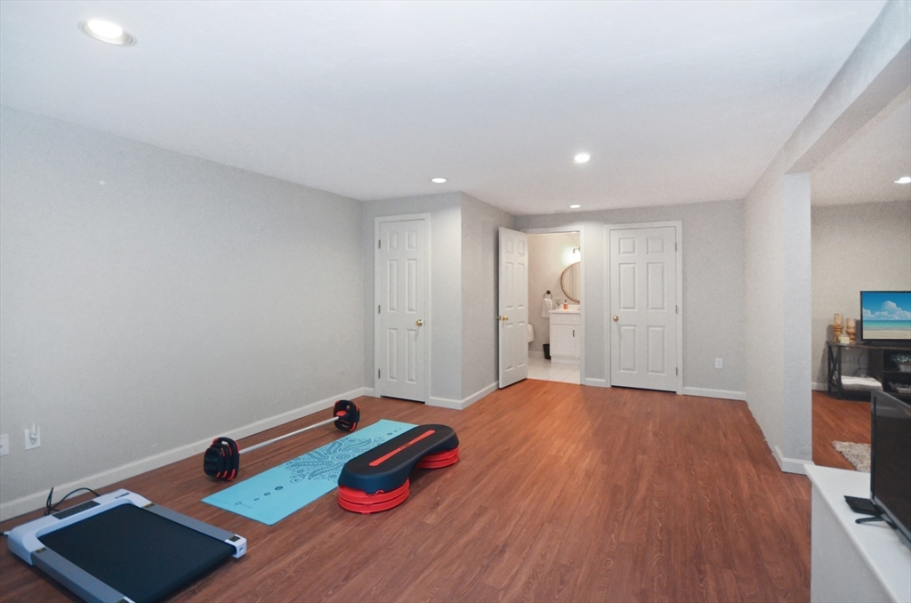 20 Millers Way, Unit C Sutton, MA 01590 - Photo 32 of 41 a bedroom with a bed and a wooden floor