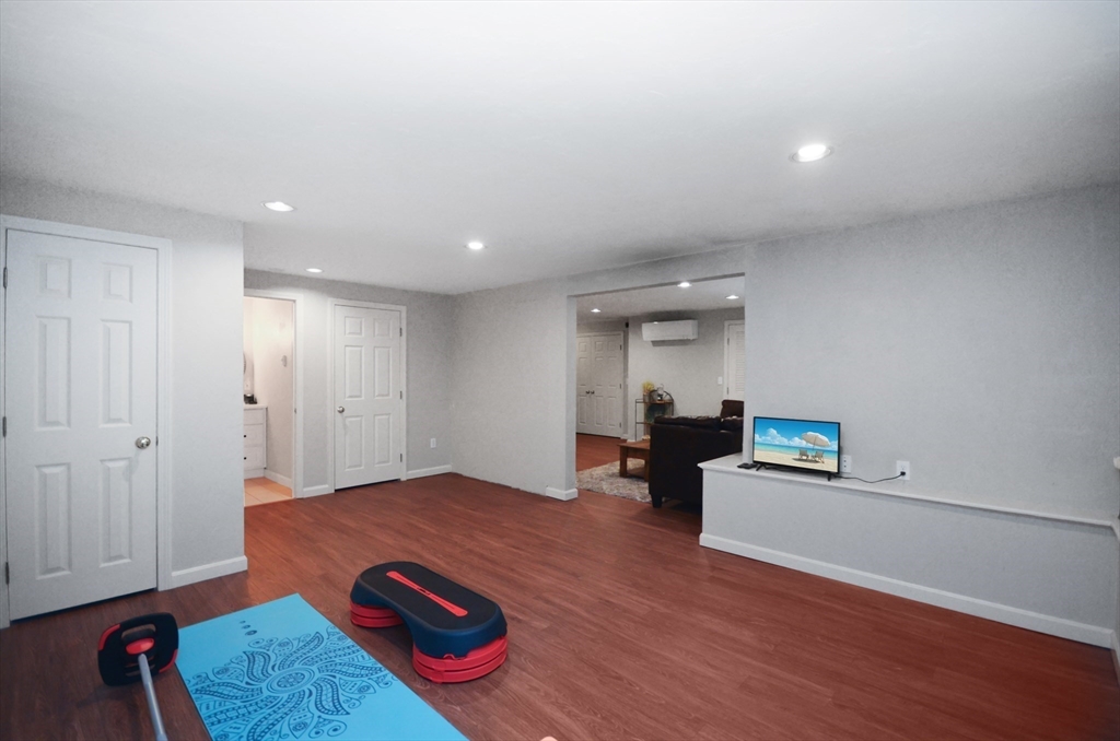 20 Millers Way, Unit C Sutton, MA 01590 - Photo 33 of 41 a living room with furniture and a wooden floor