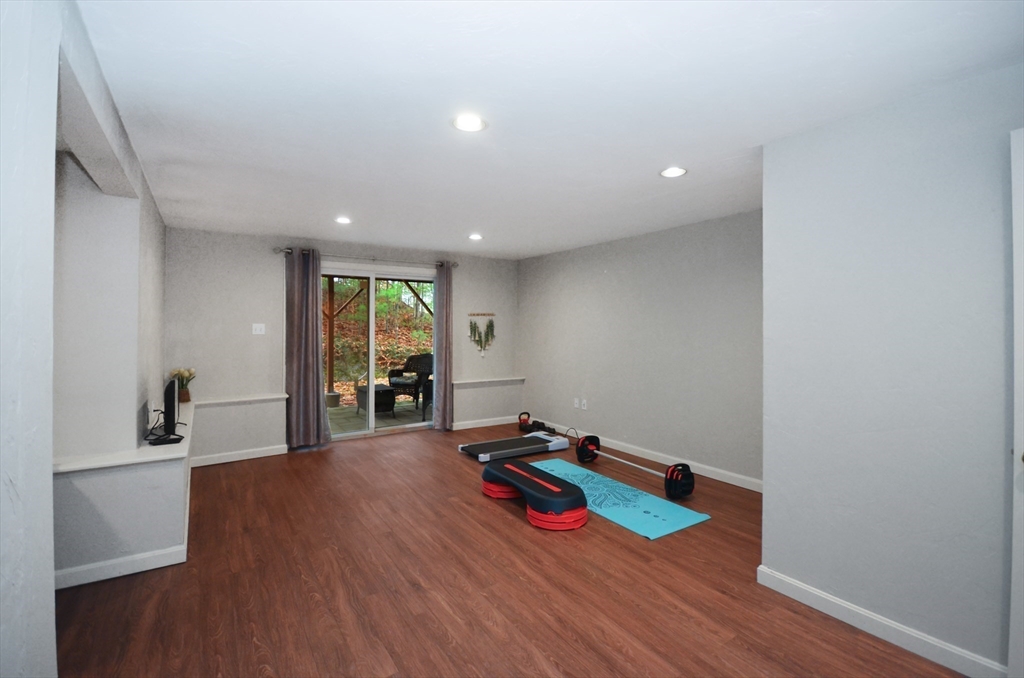 20 Millers Way, Unit C Sutton, MA 01590 - Photo 34 of 41 a room with wooden floor and pool table