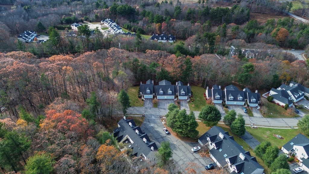 20 Millers Way, Unit C Sutton, MA 01590 - Photo 5 of 41 an aerial view of a house with a yard and lake view