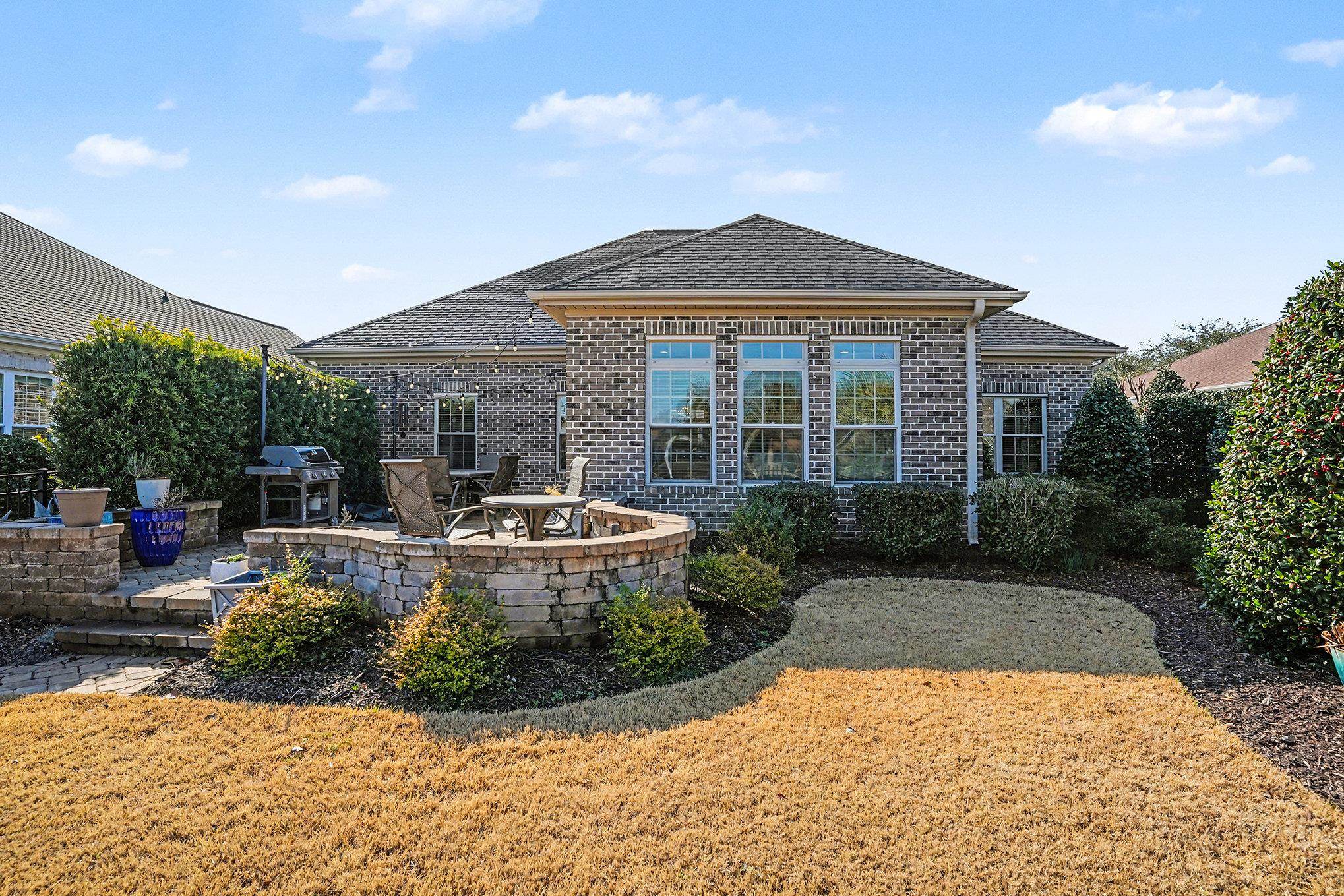 896 Marsala Drive Myrtle Beach, SC 29572 - Photo 26 of 33 Rear view of house featuring a patio area, brick siding, and a shingled roof
