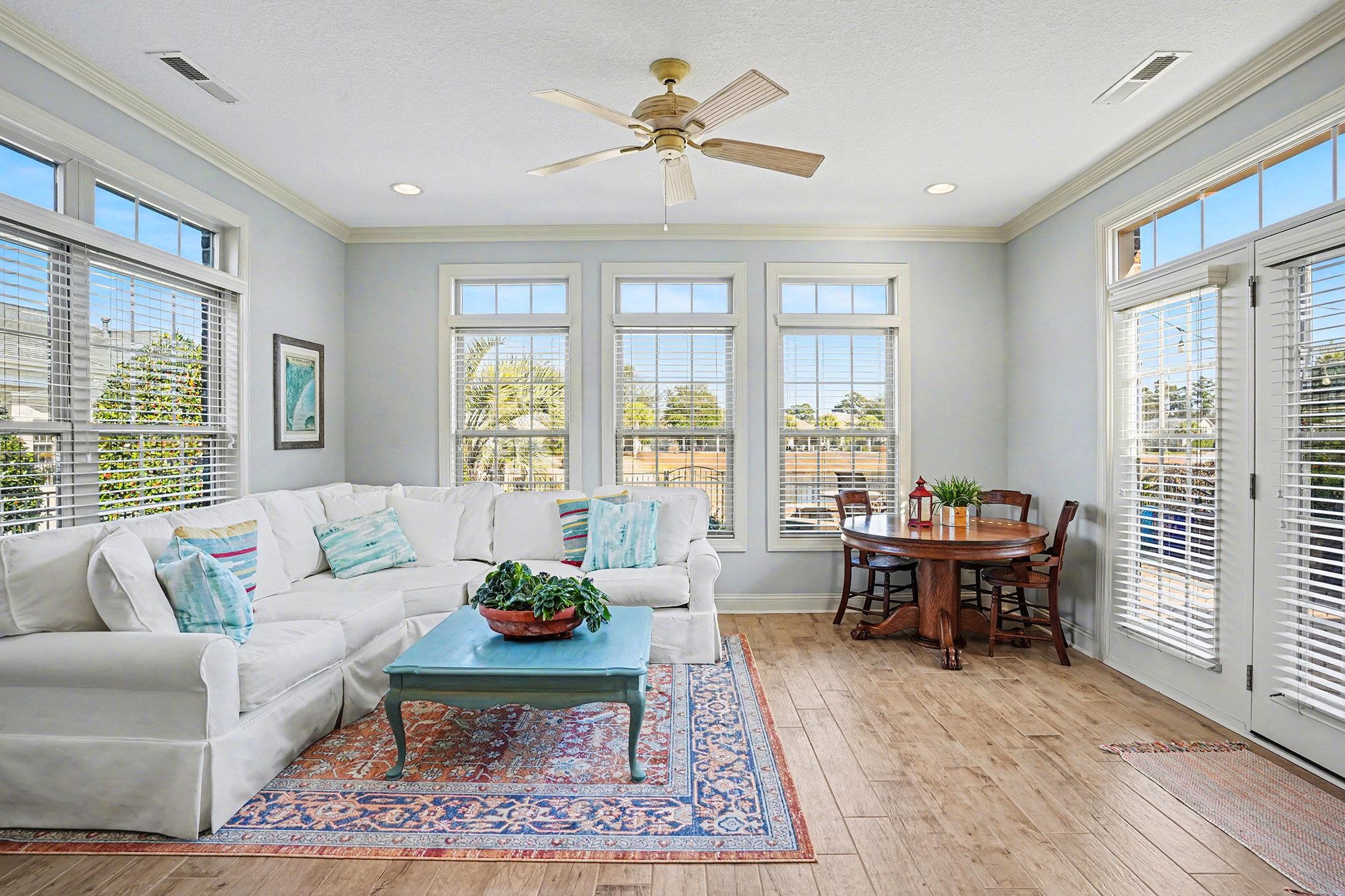 896 Marsala Drive Myrtle Beach, SC 29572 - Photo 5 of 33 Living room featuring ornamental molding, a ceiling fan, and light wood finished floors