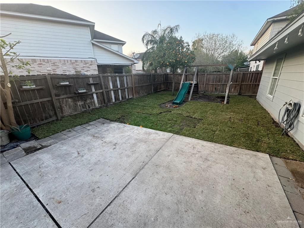 4110 Santa Fabiola Mission, TX 78572 - Photo 12 of 13 a backyard of a house with plants and wooden fence