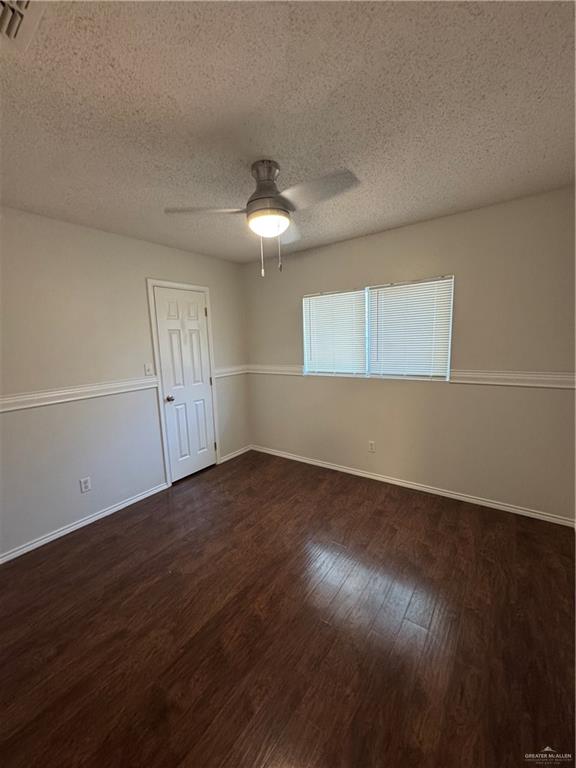 4110 Santa Fabiola Mission, TX 78572 - Photo 10 of 13 an empty room with wooden floor and windows