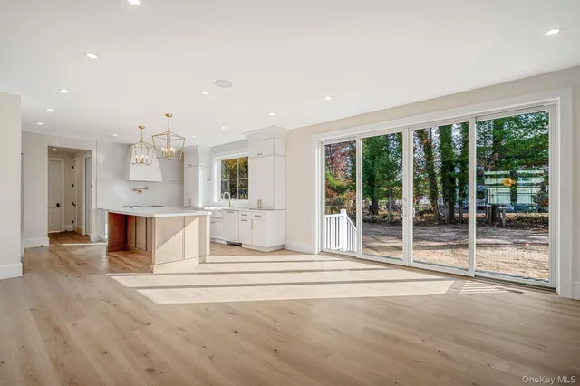 a view of kitchen with furniture and large windows