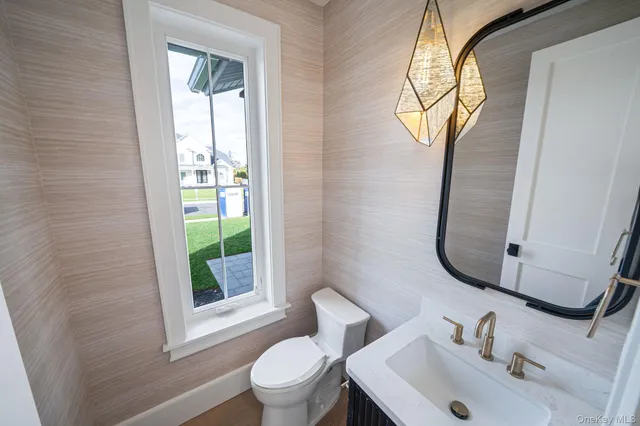 a kitchen with granite countertop a sink and a stove