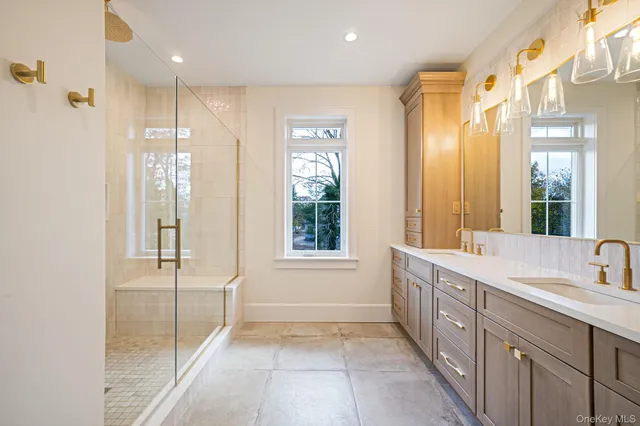 a bathroom with a granite countertop sink mirror and double
