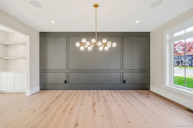 a view of a livingroom with a chandelier fan