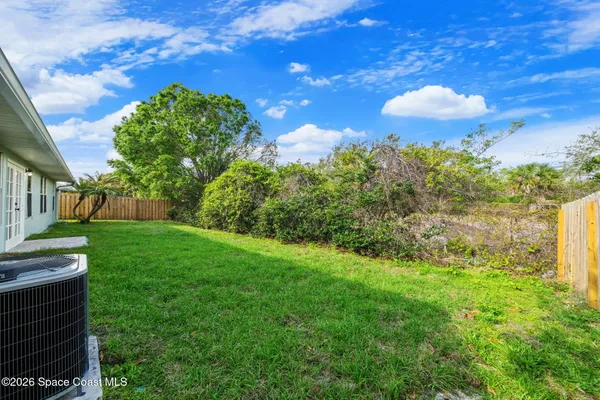 a view of a garden with a fountain