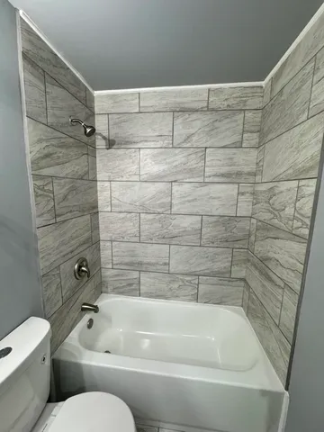 a bedroom with bed and window