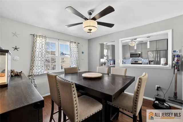 a dining room with furniture and window