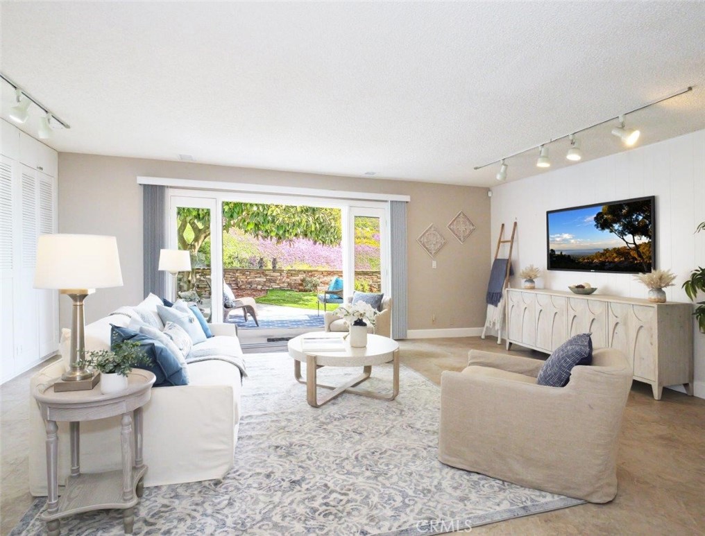 29444 Stonecrest Road Rancho Palos Verdes, CA 90275 - Photo 9 of 33 a living room with furniture and a flat screen tv