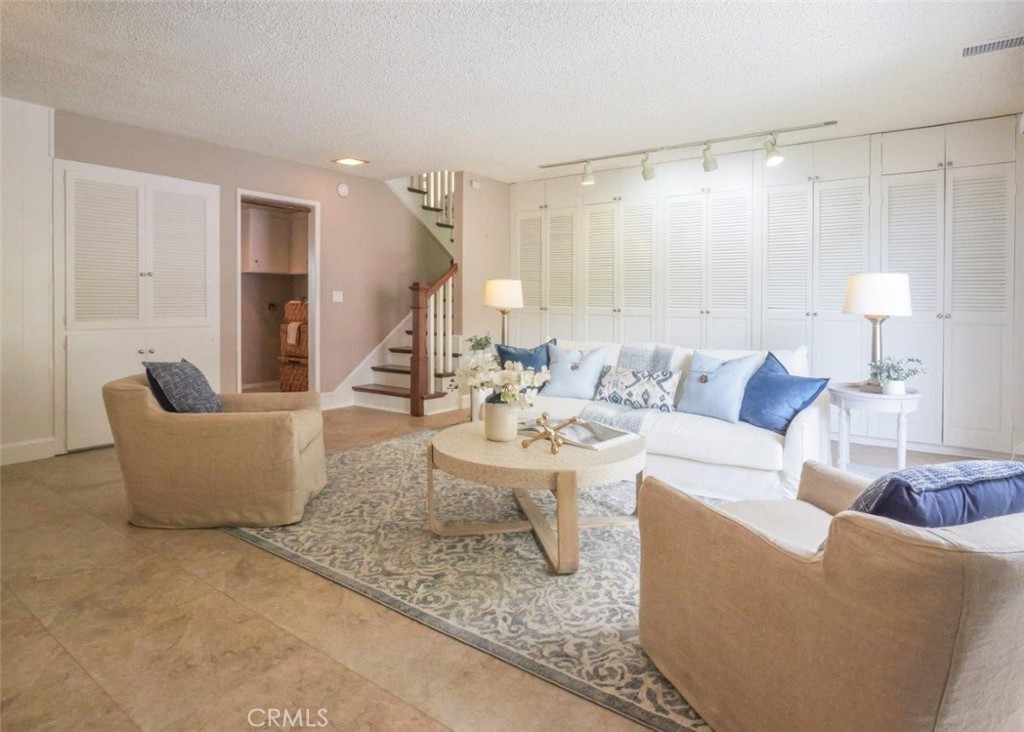 29444 Stonecrest Road Rancho Palos Verdes, CA 90275 - Photo 10 of 33 a living room with couches and a potted plant on a coffee table