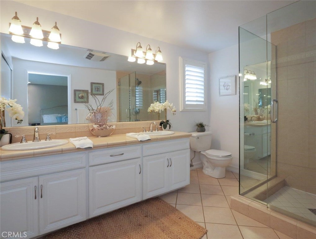 29444 Stonecrest Road Rancho Palos Verdes, CA 90275 - Photo 13 of 33 a spacious bathroom with a double vanity sink mirror and toilet
