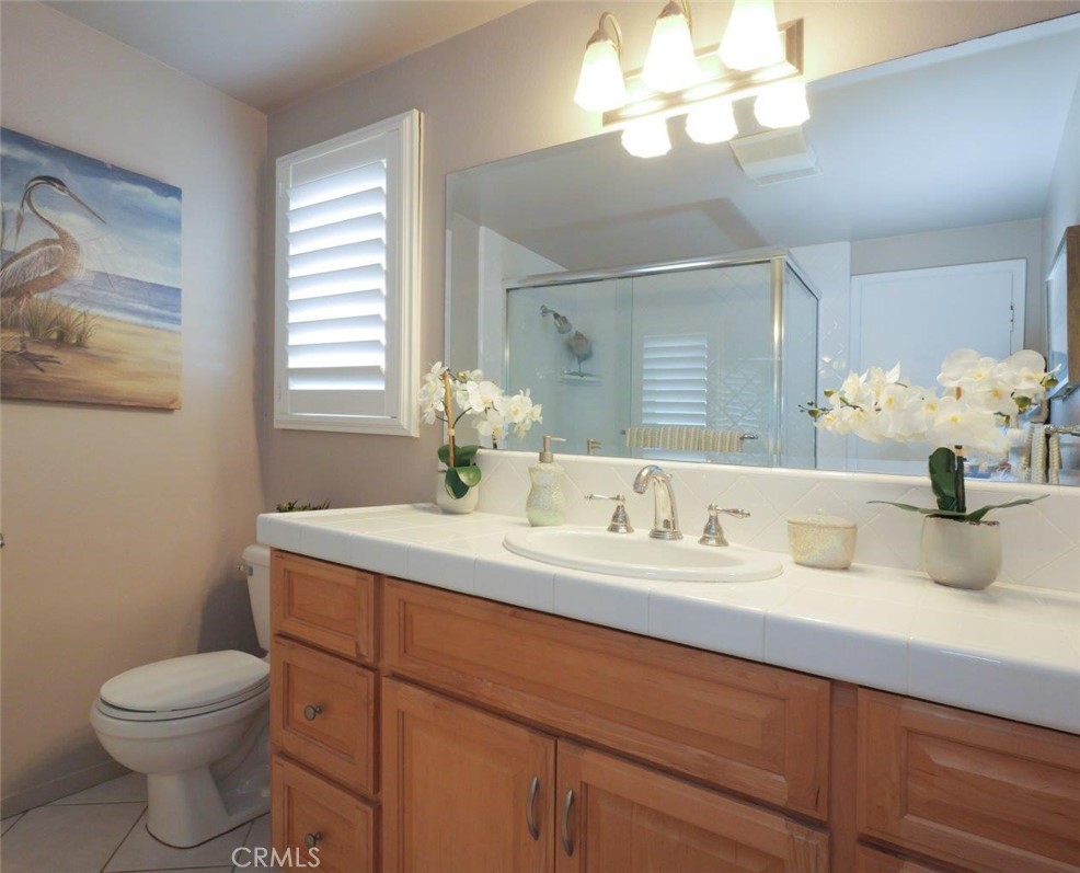 29444 Stonecrest Road Rancho Palos Verdes, CA 90275 - Photo 17 of 33 a bathroom with a sink a toilet and a mirror
