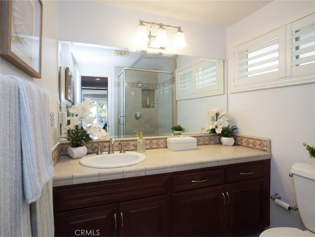 29444 Stonecrest Road Rancho Palos Verdes, CA 90275 - Photo 20 of 33 a bathroom with a sink vanity granite and a mirror