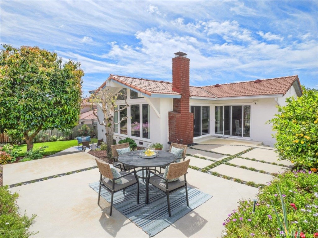 29444 Stonecrest Road Rancho Palos Verdes, CA 90275 - Photo 23 of 33 a view of a patio with table and chairs and potted plants