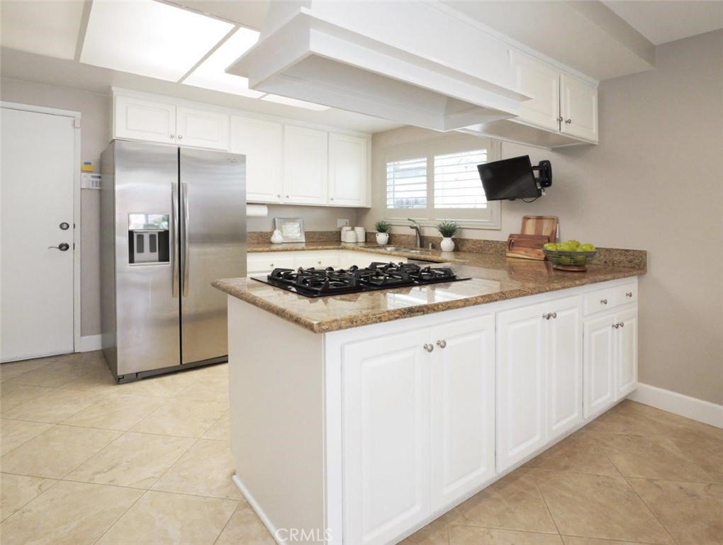29444 Stonecrest Road Rancho Palos Verdes, CA 90275 - Photo 5 of 33 a kitchen with stainless steel appliances granite countertop a sink stove and refrigerator