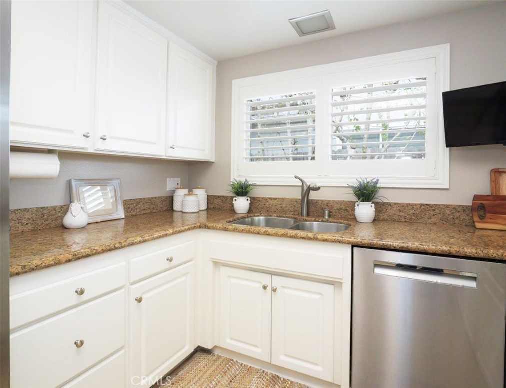 29444 Stonecrest Road Rancho Palos Verdes, CA 90275 - Photo 6 of 33 a kitchen with granite countertop white cabinets and a window