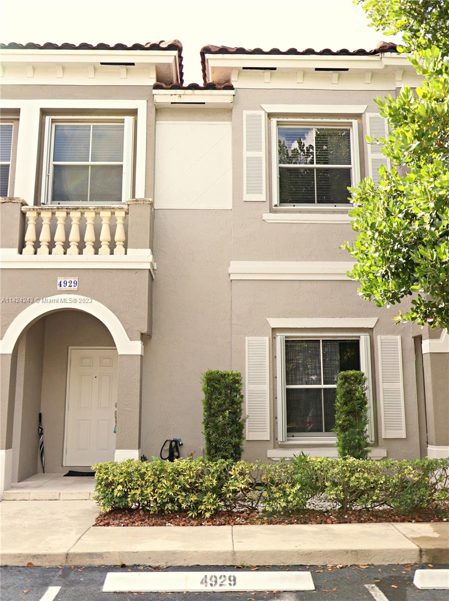 4929 Southwest 140th Terrace, Unit 5 Miramar, FL 33027 - Photo 1 of 24 a front view of a house