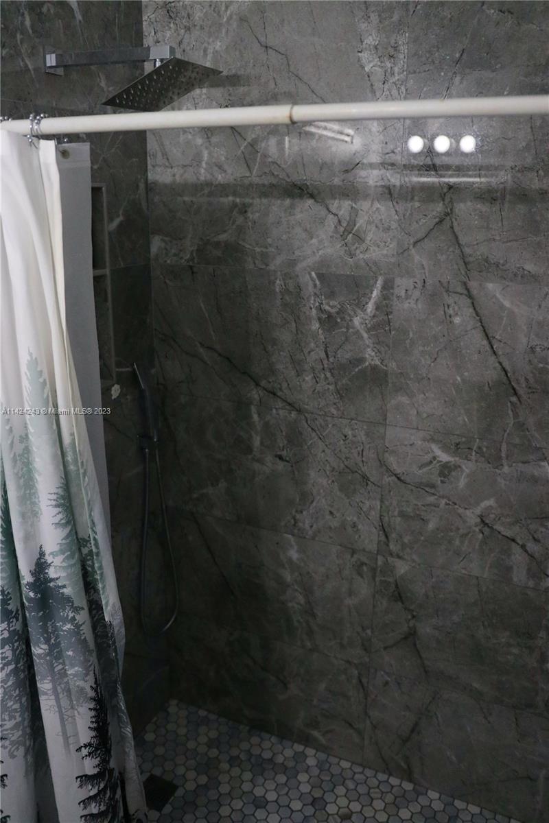 4929 Southwest 140th Terrace, Unit 5 Miramar, FL 33027 - Photo 11 of 24 a close view of a bathroom shower