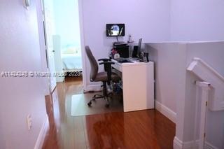 4929 Southwest 140th Terrace, Unit 5 Miramar, FL 33027 - Photo 18 of 24 a view of a workspace with furniture and a window