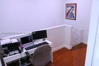 4929 Southwest 140th Terrace, Unit 5 Miramar, FL 33027 - Photo 20 of 24 a view of a workspace with furniture and a window