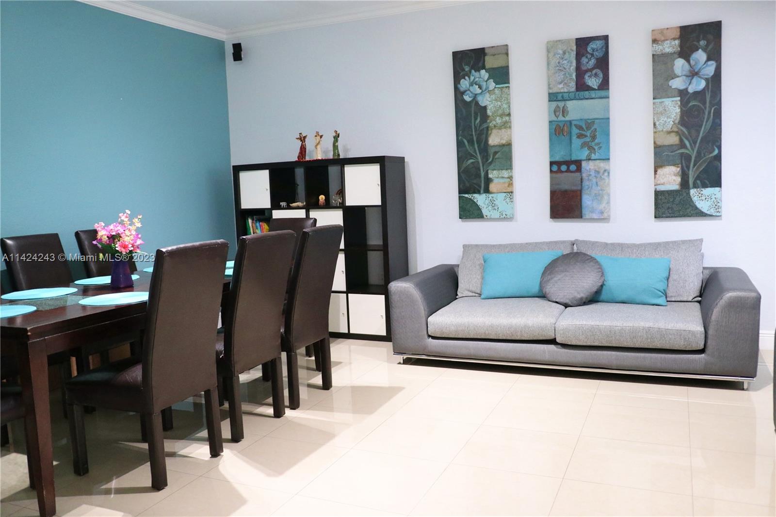 4929 Southwest 140th Terrace, Unit 5 Miramar, FL 33027 - Photo 2 of 24 a living room with furniture and wooden floor