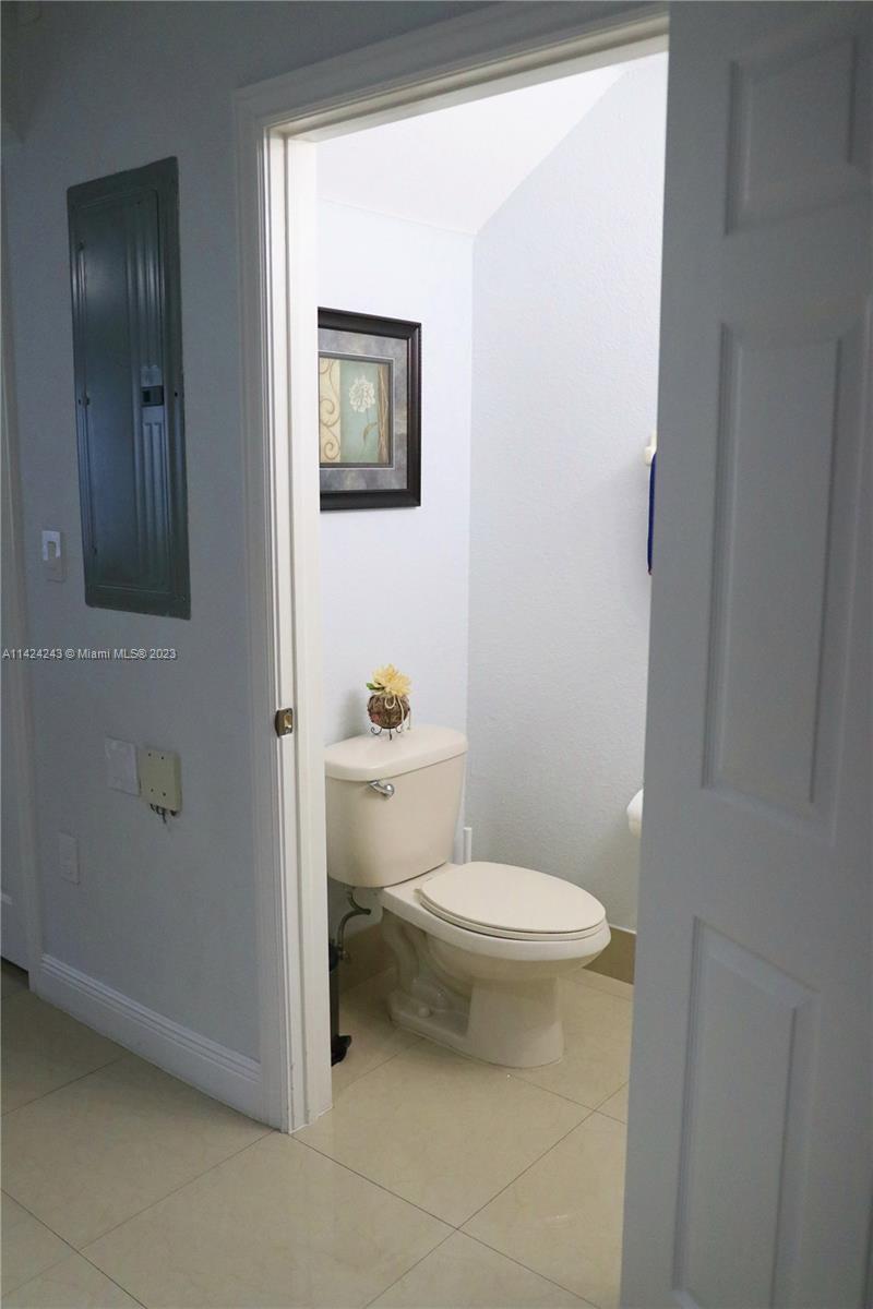 4929 Southwest 140th Terrace, Unit 5 Miramar, FL 33027 - Photo 8 of 24 a bathroom with a toilet