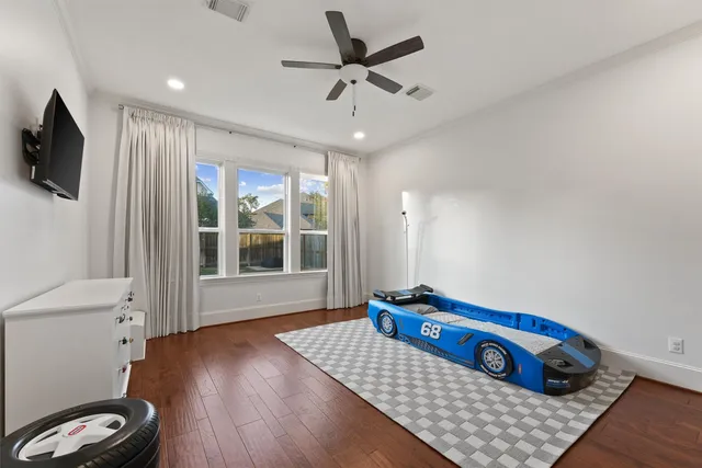 a bedroom with furniture and a window