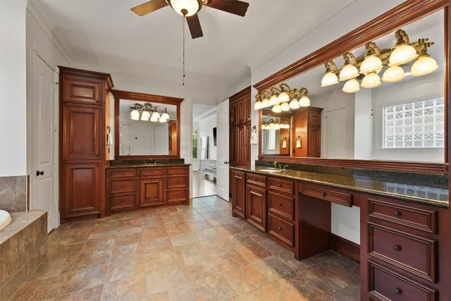 a large kitchen with kitchen island granite countertop a large island in the center and stainless steel appliances