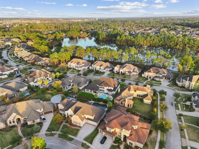an aerial view of residential houses with outdoor space
