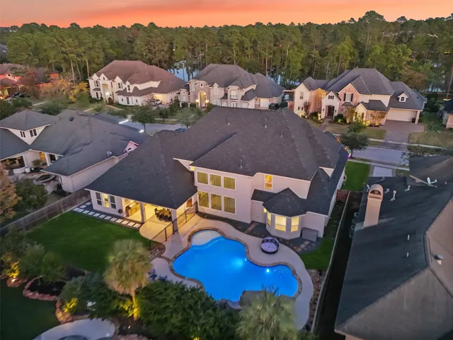an aerial view of residential houses with outdoor space