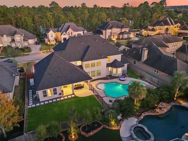 an aerial view of a house with a garden