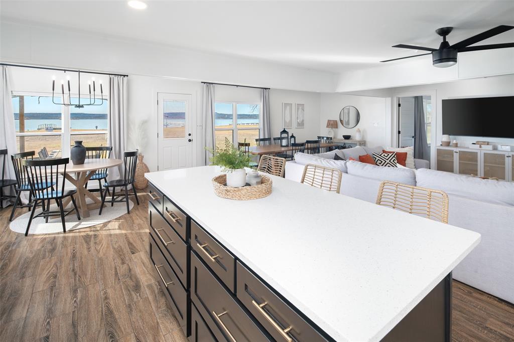 1169 Willow Road Graford, TX 76449 - Photo 11 of 40 a view of a dining room with furniture and wooden floor