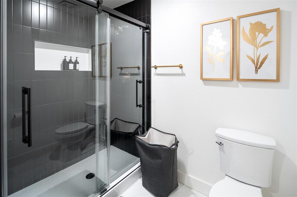 1169 Willow Road Graford, TX 76449 - Photo 20 of 40 a bathroom with a shower and toilet